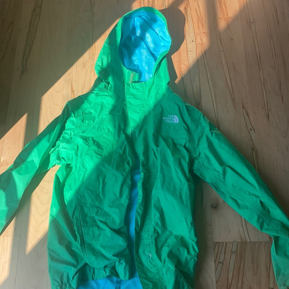 Green north face jacket.